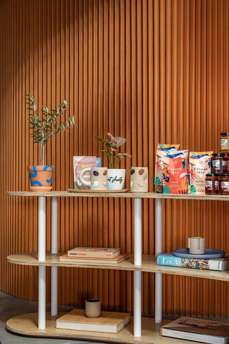 Black Spaces iteration of Hunker House showroom featuring products on shelving