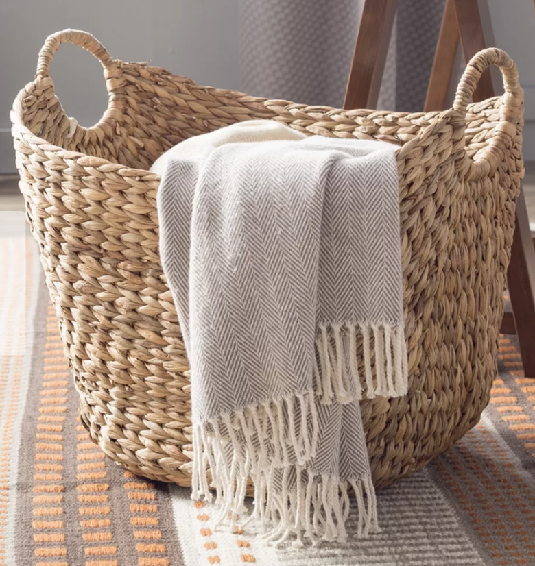 tall wicker basket with handles