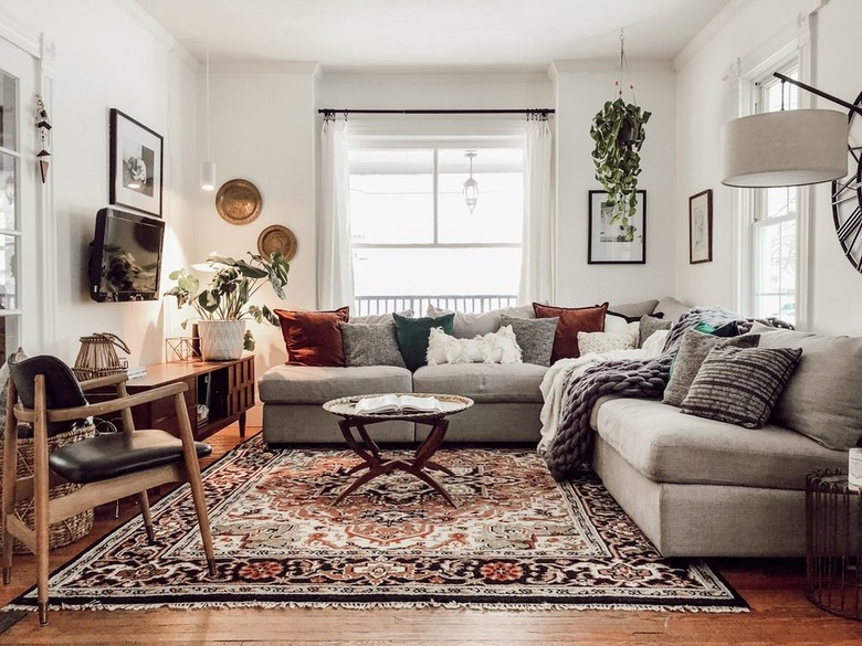 Eclectic living room with gray couches