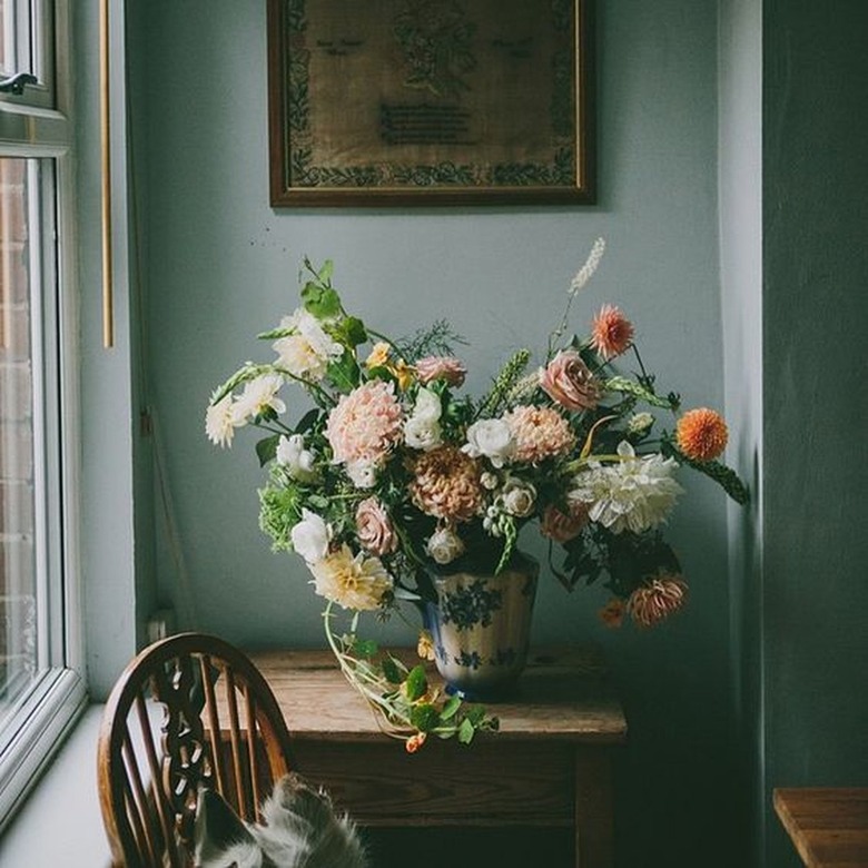 sage green wall paint French country living room corner
