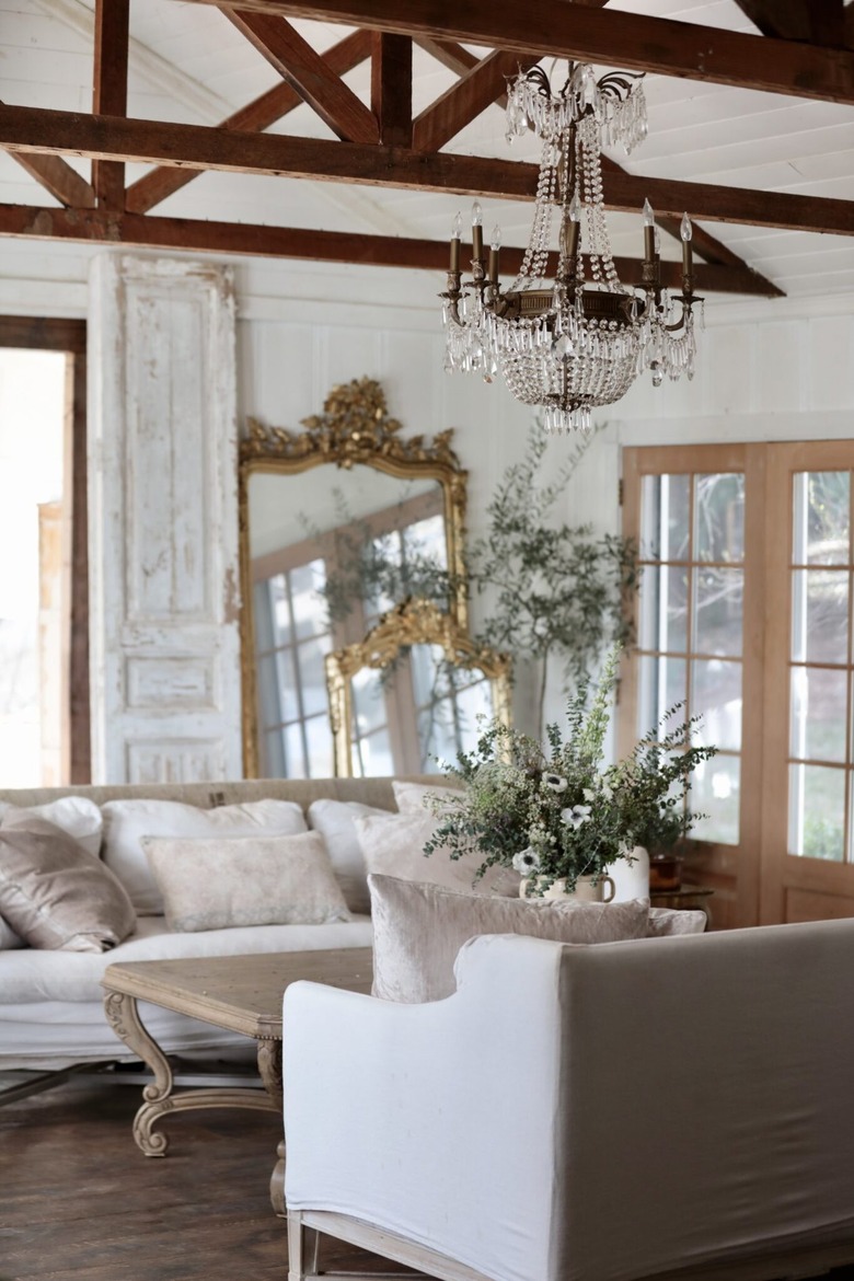 french country living room with chandelier