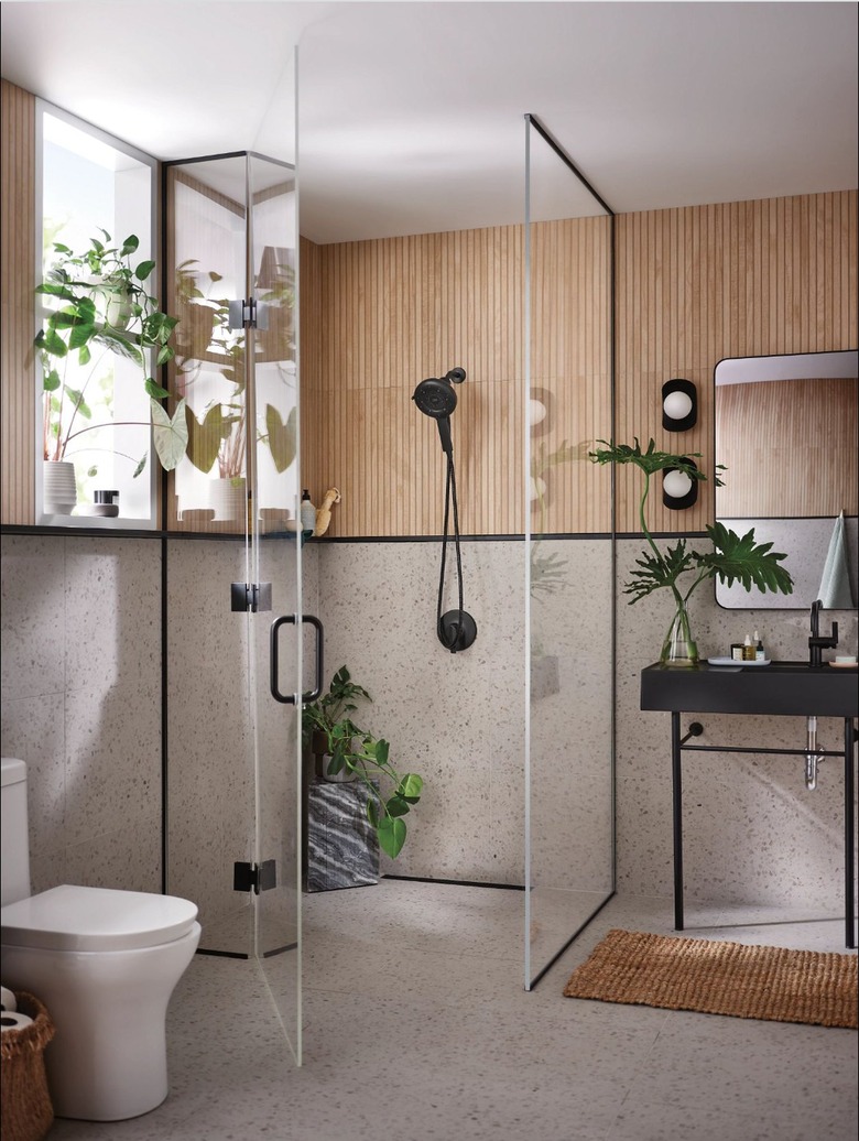 Industrial bathroom with black fixtures and wood accents