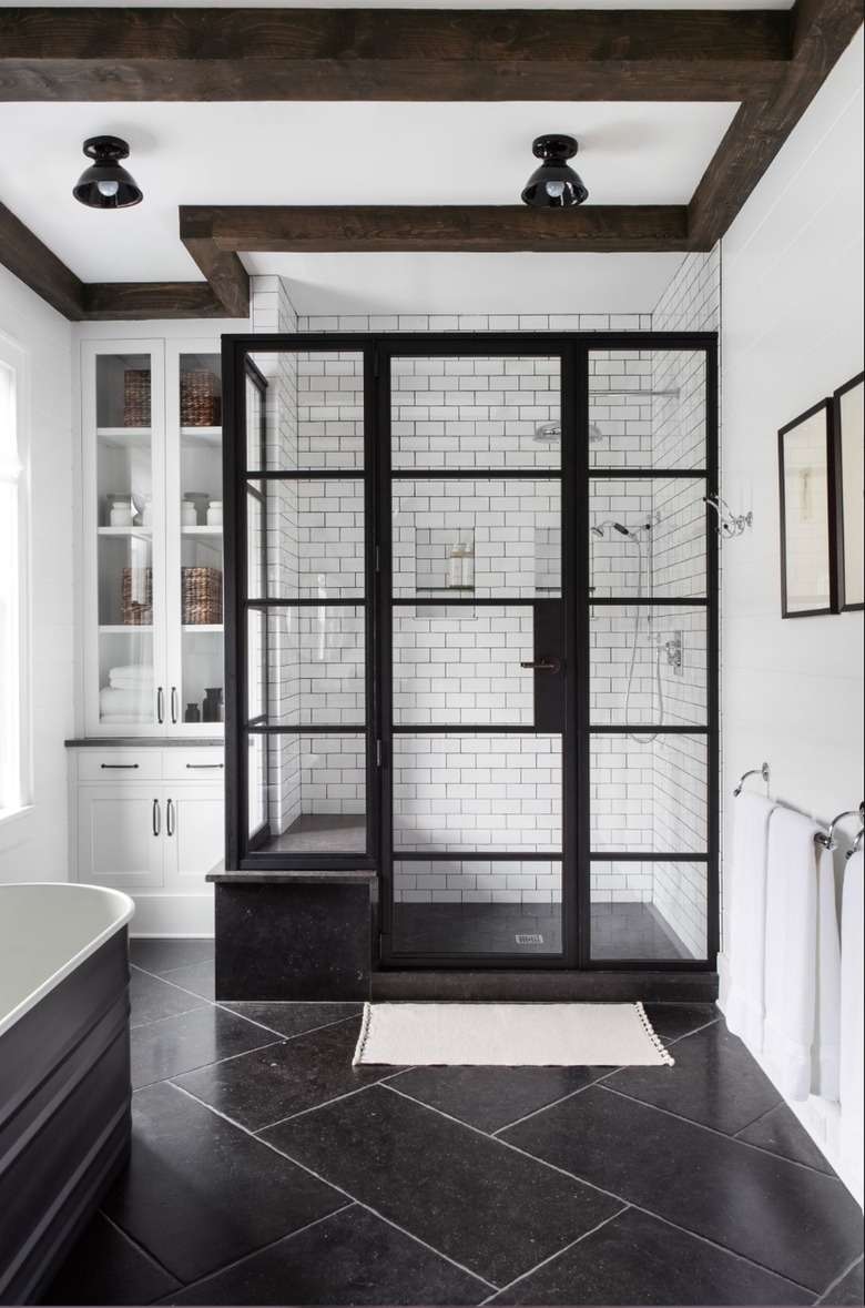 small industrial bathroom with metal shower doors
