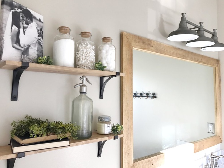 Industrial bathroom with floating shelves.