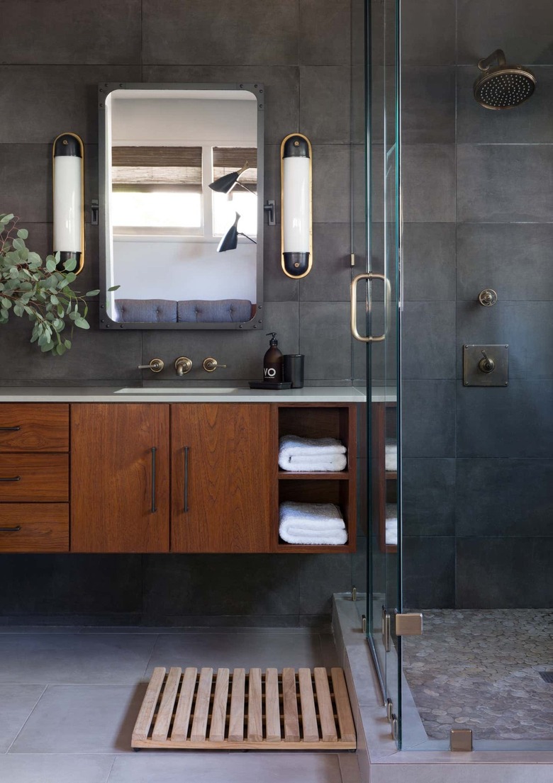 Industrial bathroom with wood vanity and metal wall