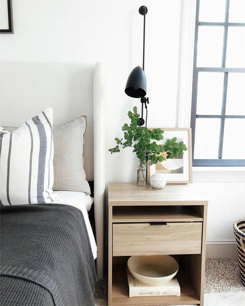 French pole-inspired wall sconce in bedroom