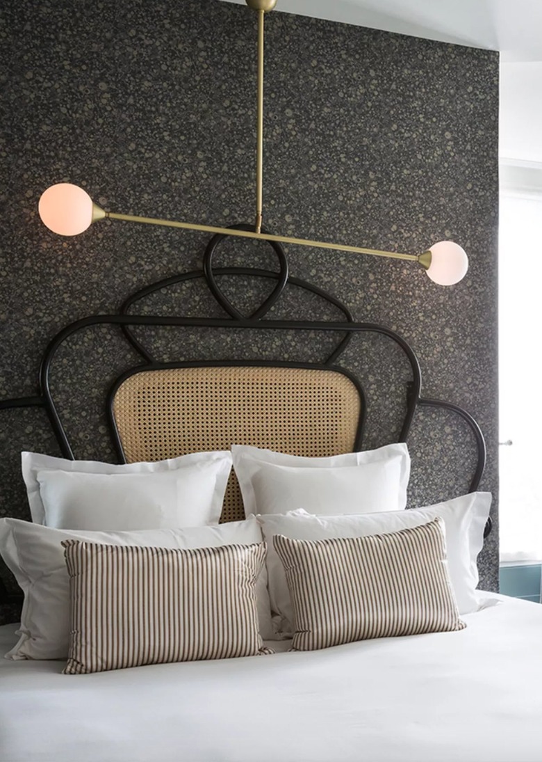 unique bronze chandelier over bed