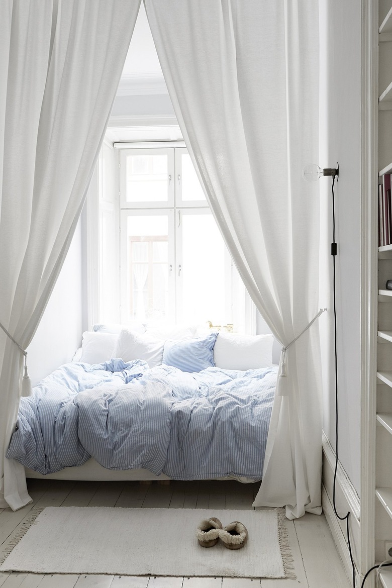 small apartment decorating ideas with a curtained off bed