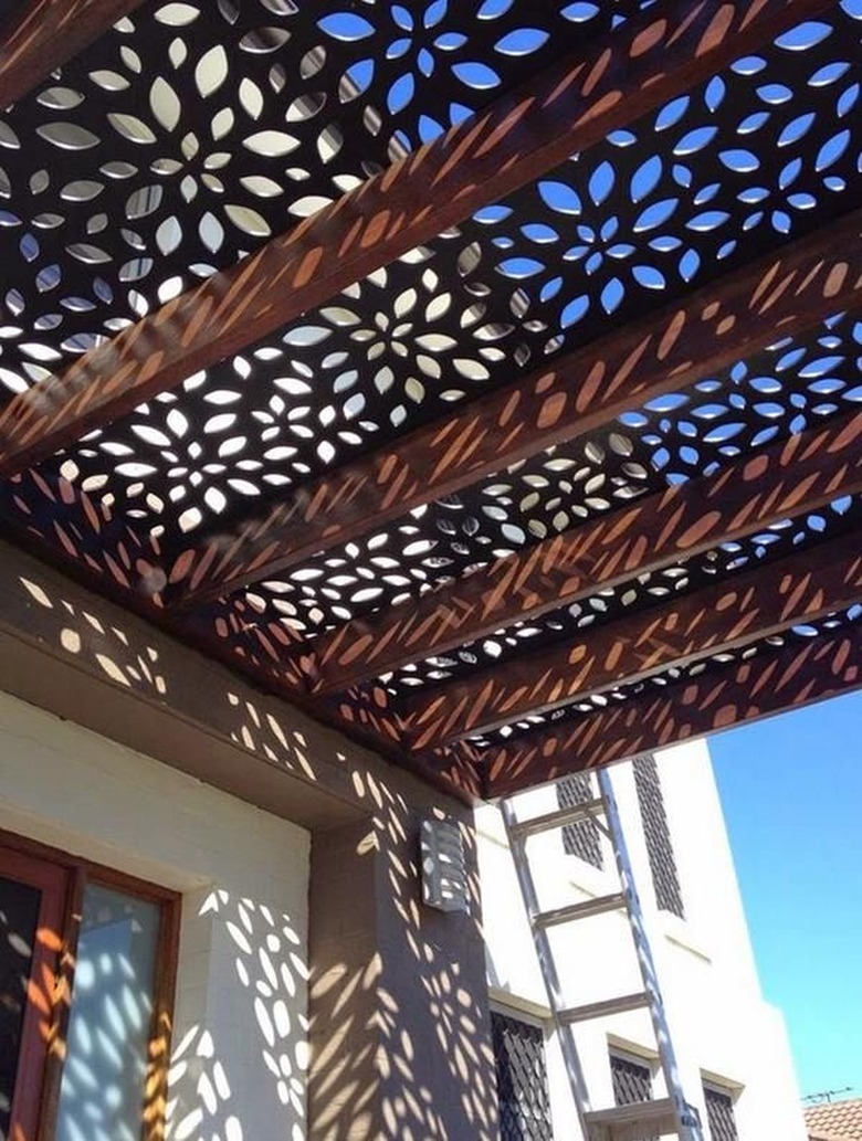 Cut metal shadow screen patio cover