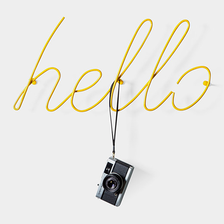 MoMA metal coat rack bent in shape of the word hello.