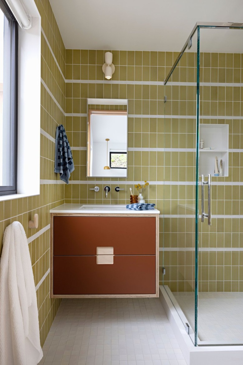 midcentury bathroom with avocado green wall tiles