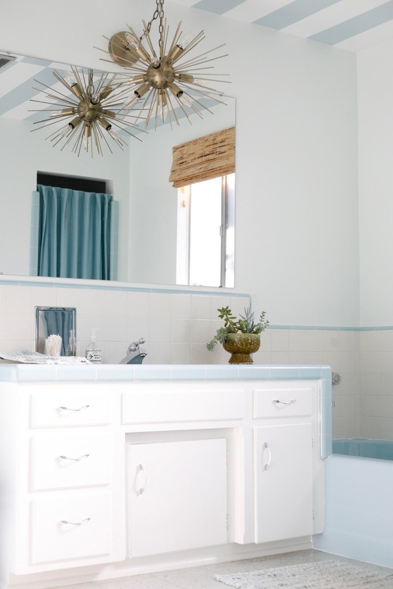 midcentury bathroom with period vintage blue and white tiles