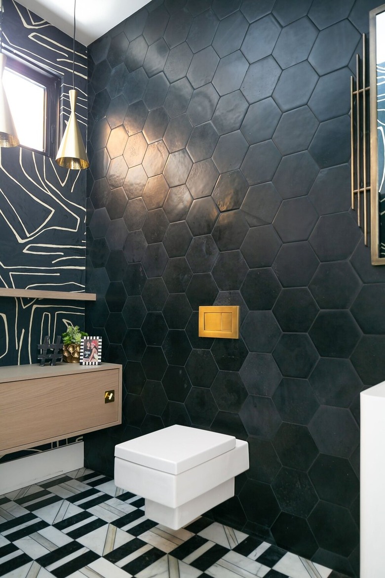 midcentury and contemporary bathroom with matte black hexagon tile wall