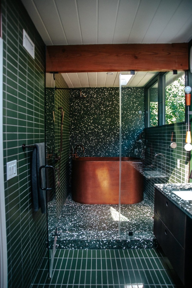 midcentury and contemporary bathroom with copper bathtub
