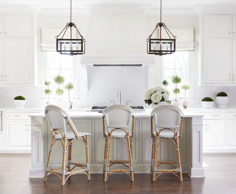 farmhouse kitchen with pendant lights hanging above island