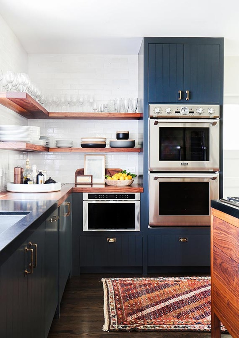farmhouse kitchen with open shelving and beadboard cabinets