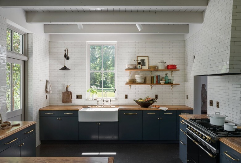 blue and white kitchen with floor-to-ceiling tile