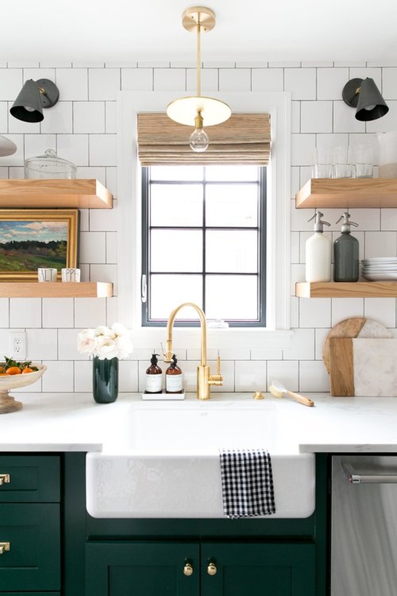 apron kitchen sink in farmhouse kitchen with green cabinets