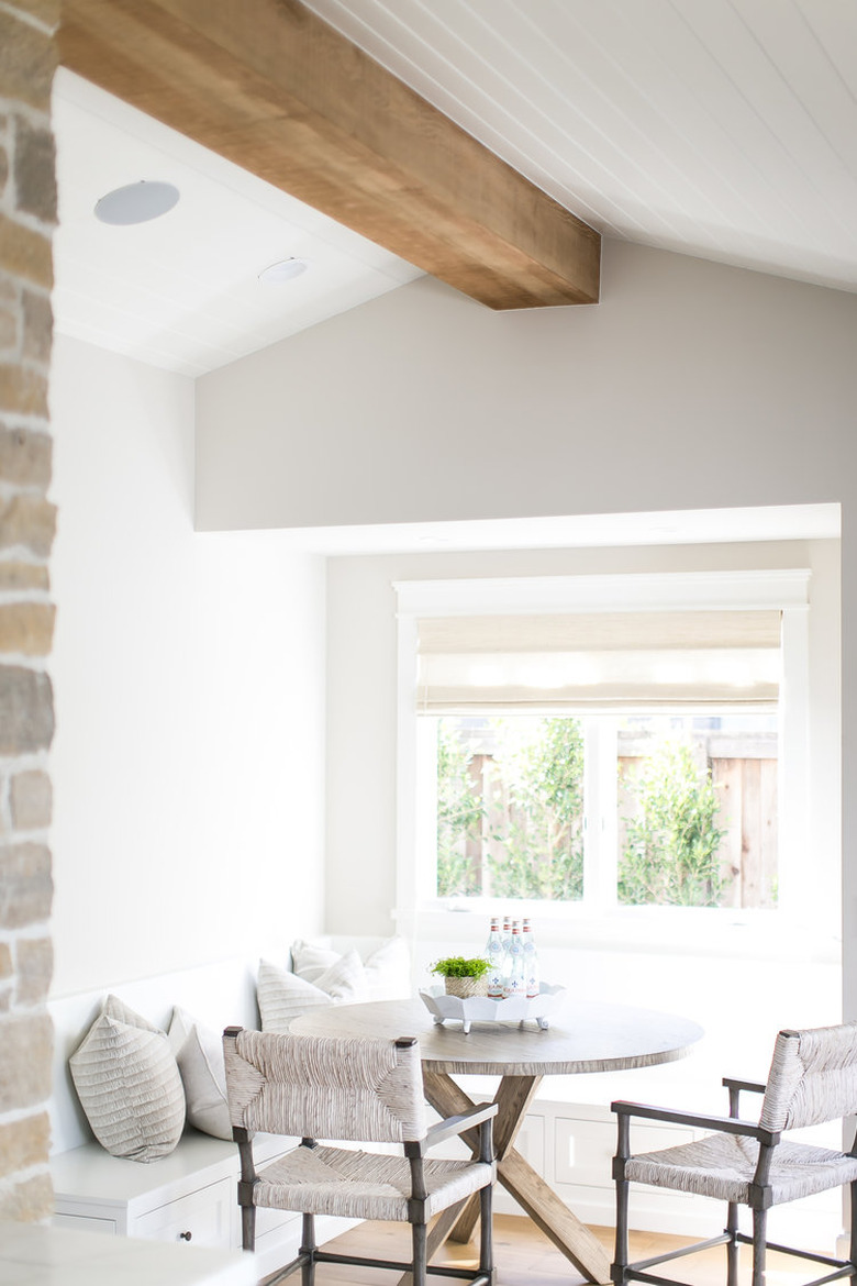 farmhouse kitchen with a breakfast nook by window