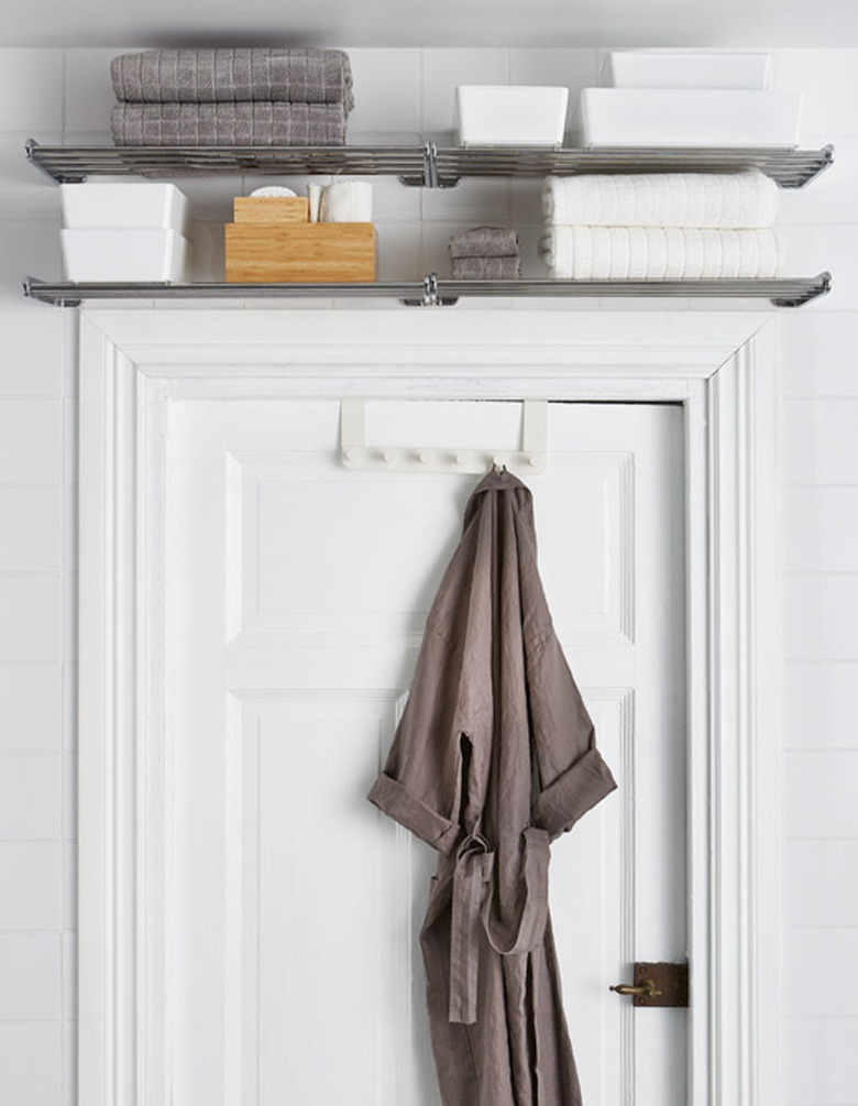 shelving unit above bathroom door