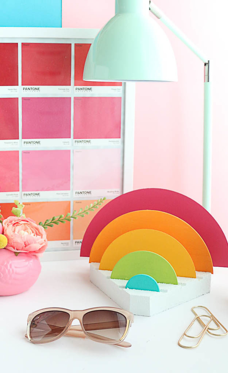 A rainbow desk organizer and brightly colored desk