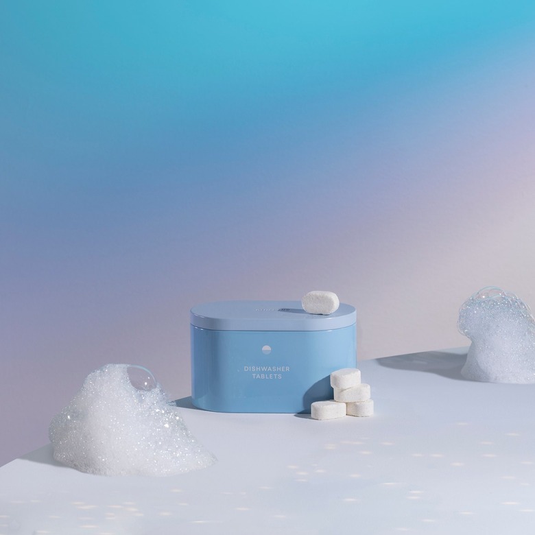 photo of dishwasher tablets near blue container