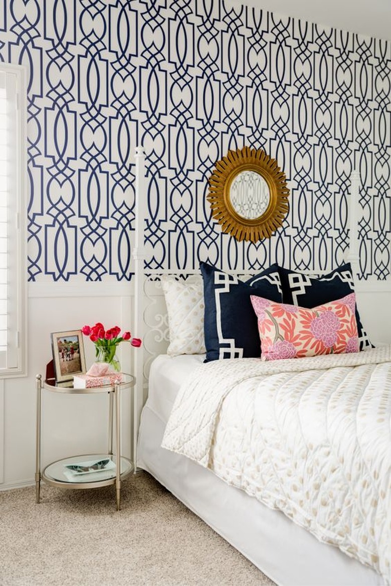 Bedroom with blue geometric wallpaper