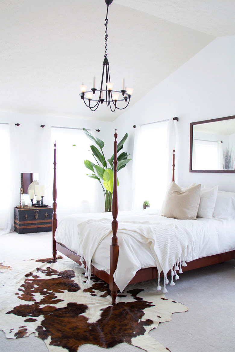Bedroom featuring cowhide rug