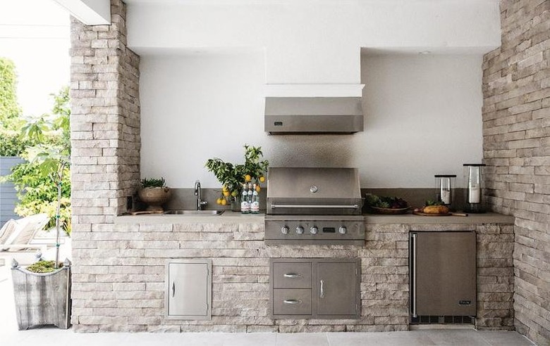 stone-clad outdoor kitchen