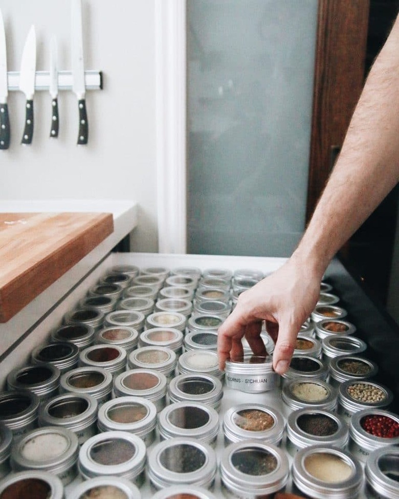 drawer filled with spice tins