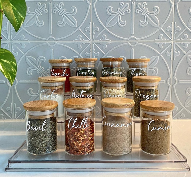 Matching spices on glass tiered organizer.