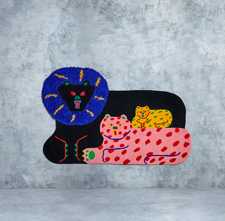 rug with three feline characters