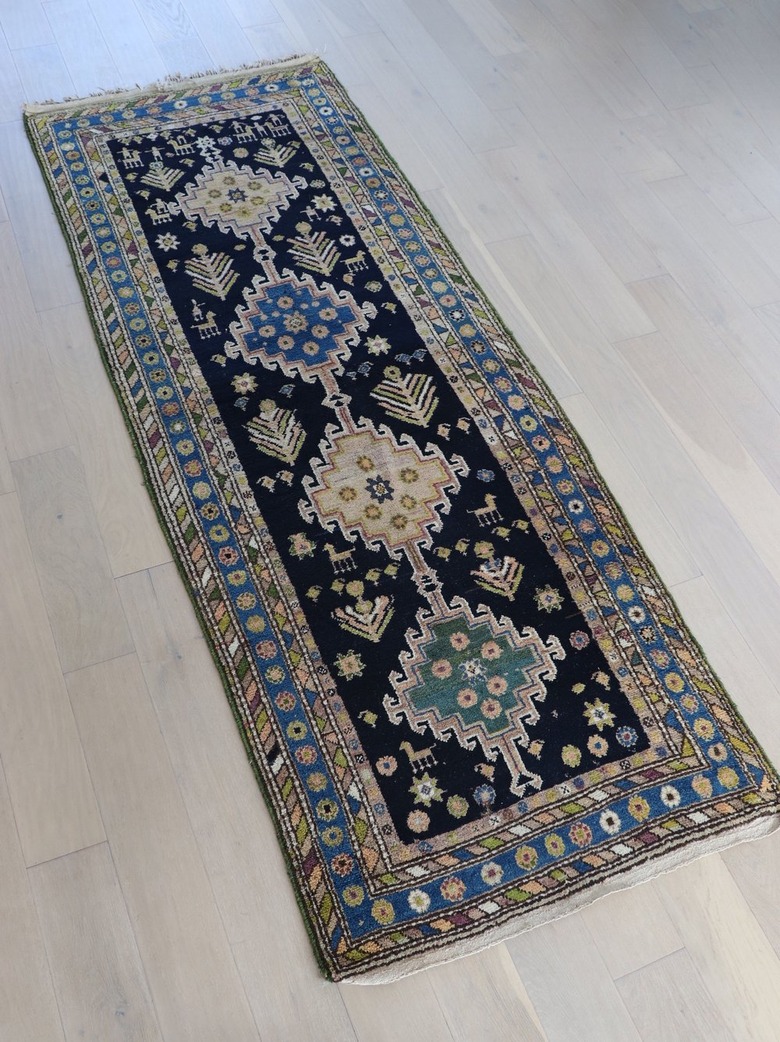 Vintage variegated runner featuring various shades of blue