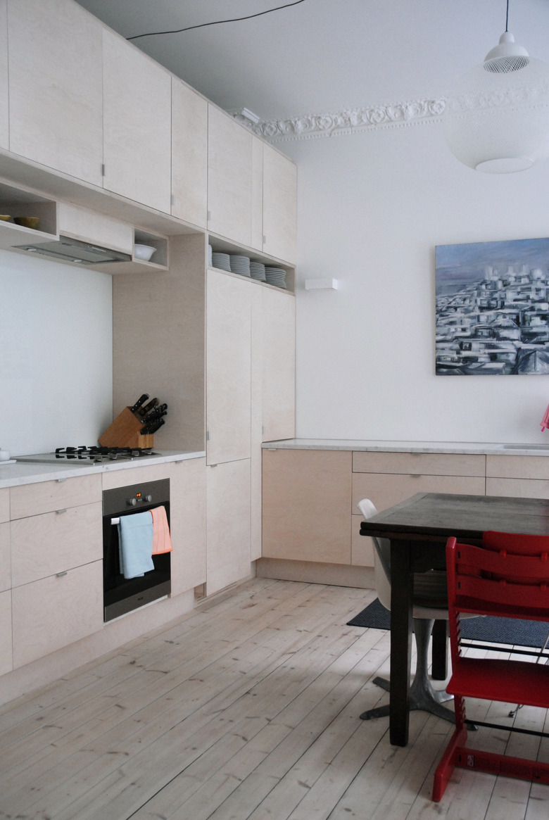 Kitchen with wood built ins and wood floor