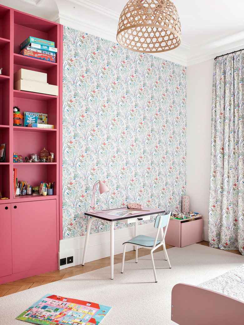 little girl's bedroom with wallpaper