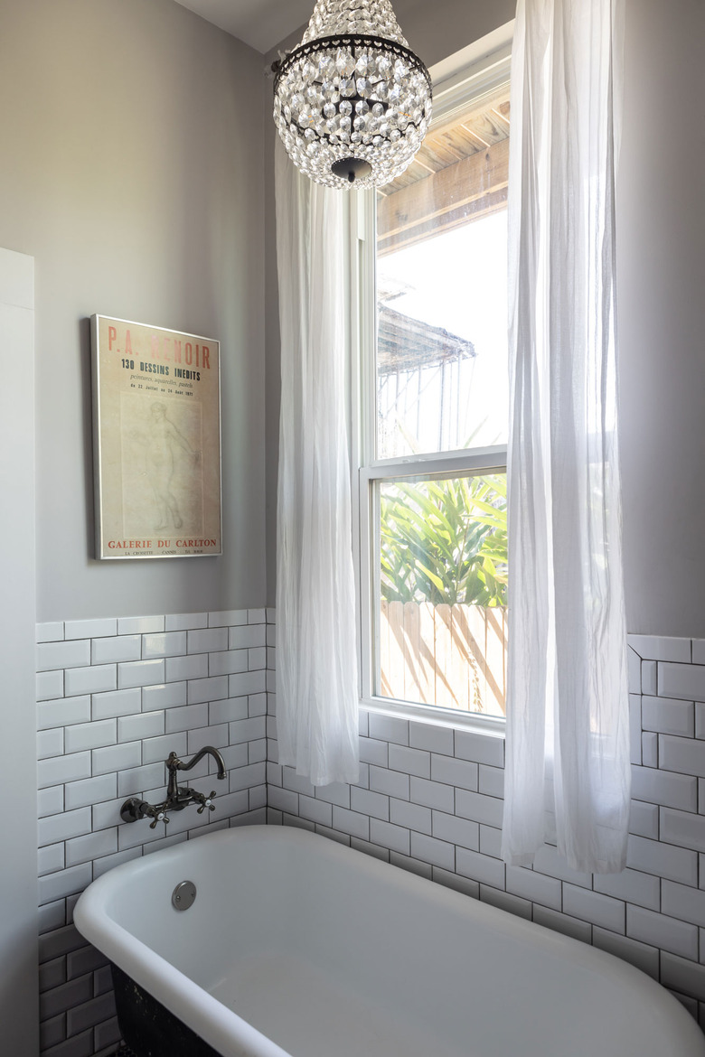 clawfoot bathtub with subway tile