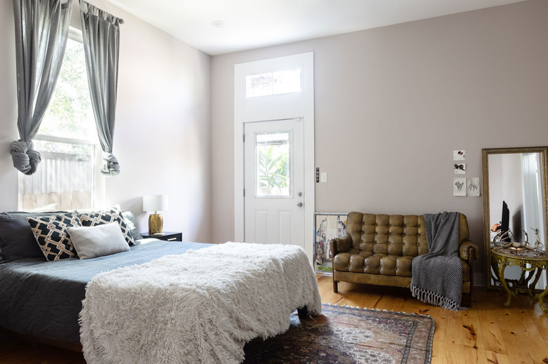 Master Bedroom with gray walls and wood floors