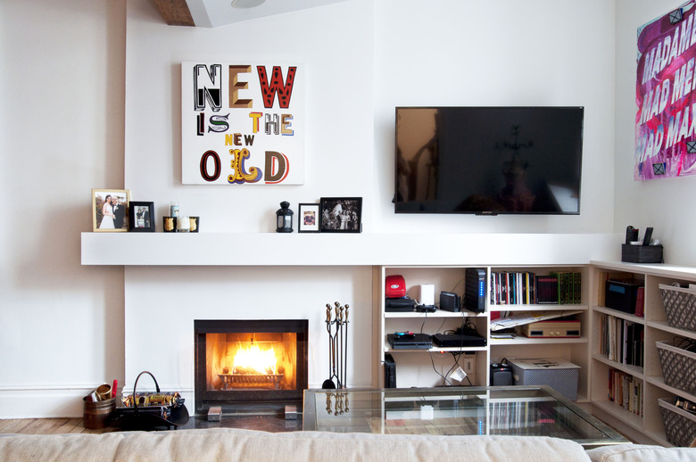 Living room with TV and fireplace