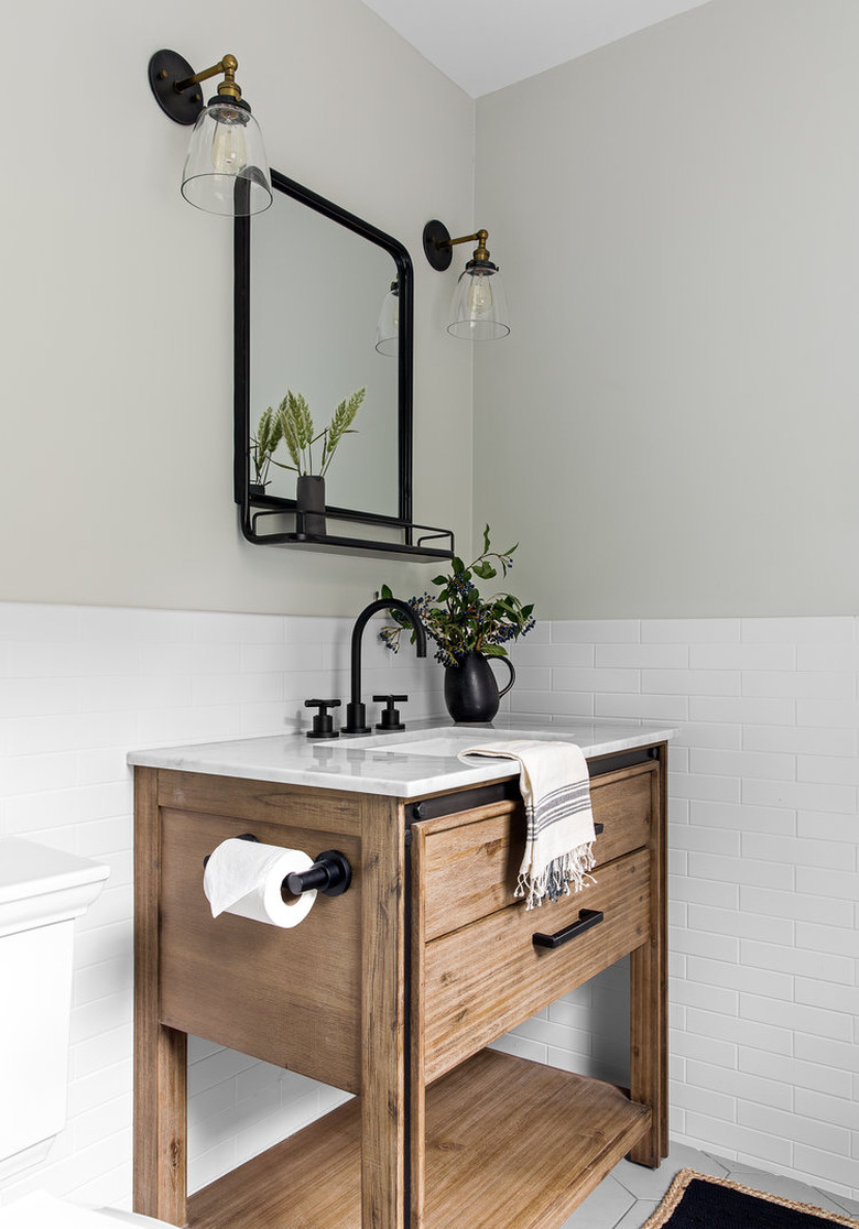 wooden sink in bright white bathroom