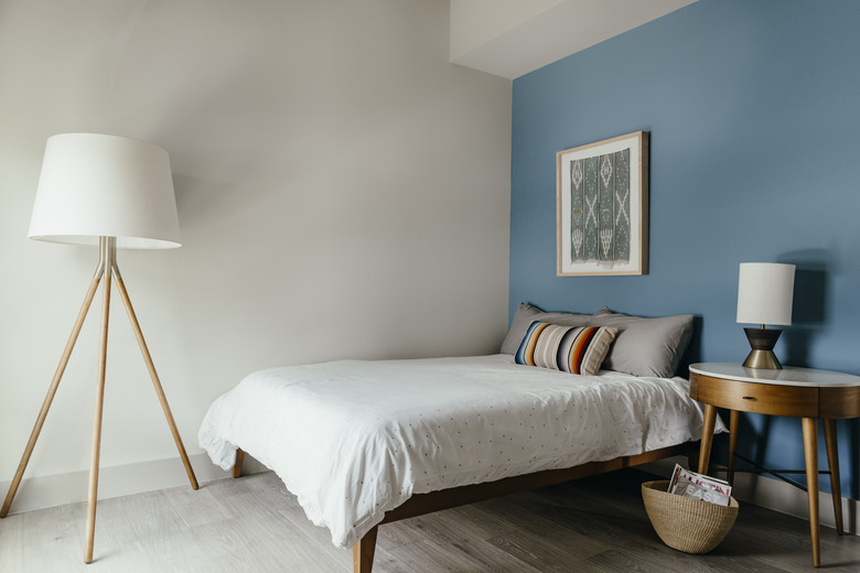 bedroom with blue accent wall