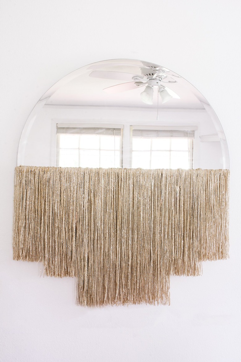 Round mirror with curtain fringe