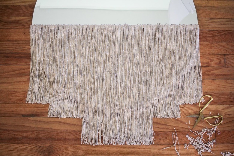 Round curtain fringe mirror with gold scissors