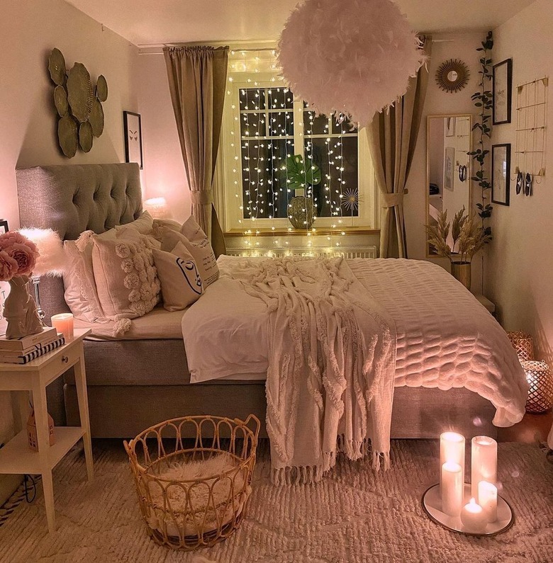 bedroom with string lights hanging vertically across window