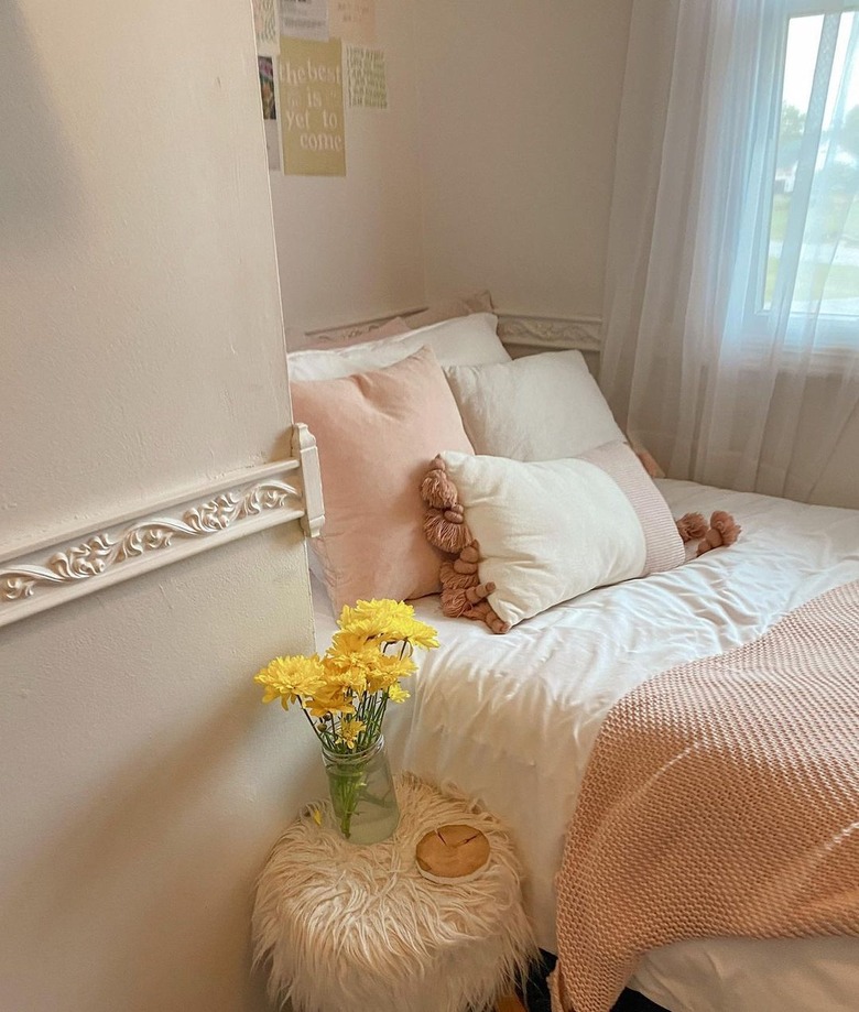 bed with throw pillows and blanket