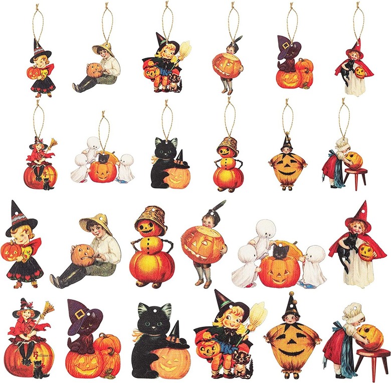 37 wooden flat ornaments featuring vintage-looking Halloween characters like ghosts