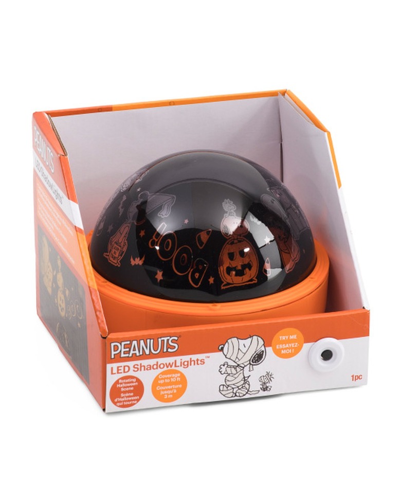 A rounded light projector with Snoopy and Halloween characters on it.
