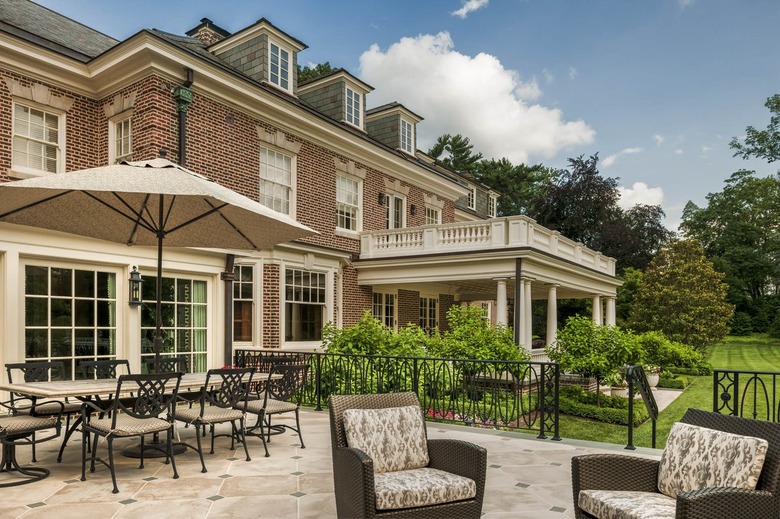 Large parasol on expansive terrace for outdoor dining