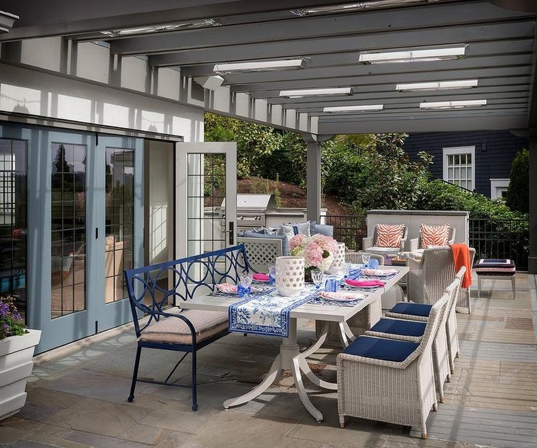 Colorful outdoor dining table setup with printed tablecloth
