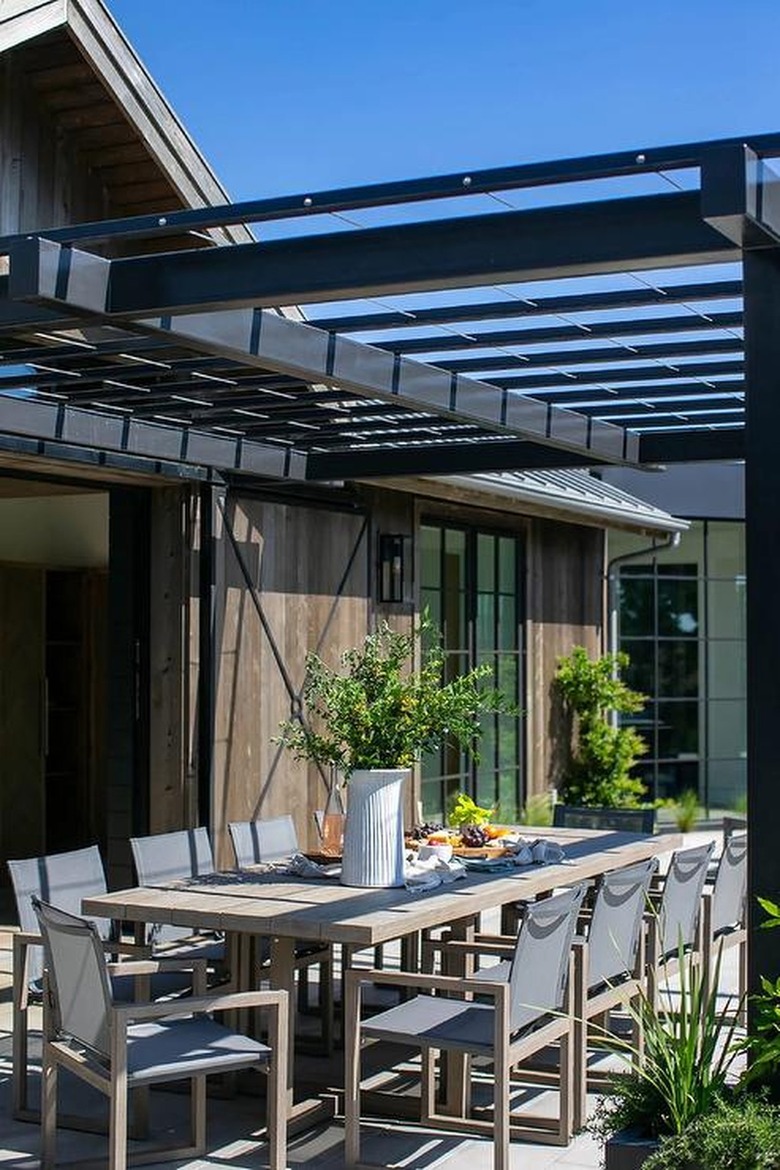 Outdoor dining table with charcuterie board to welcome guests