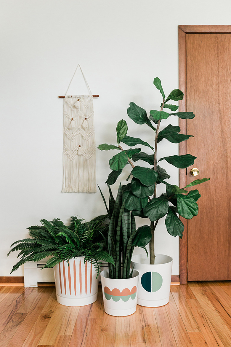 Fill your painted pots with real or faux greenery.